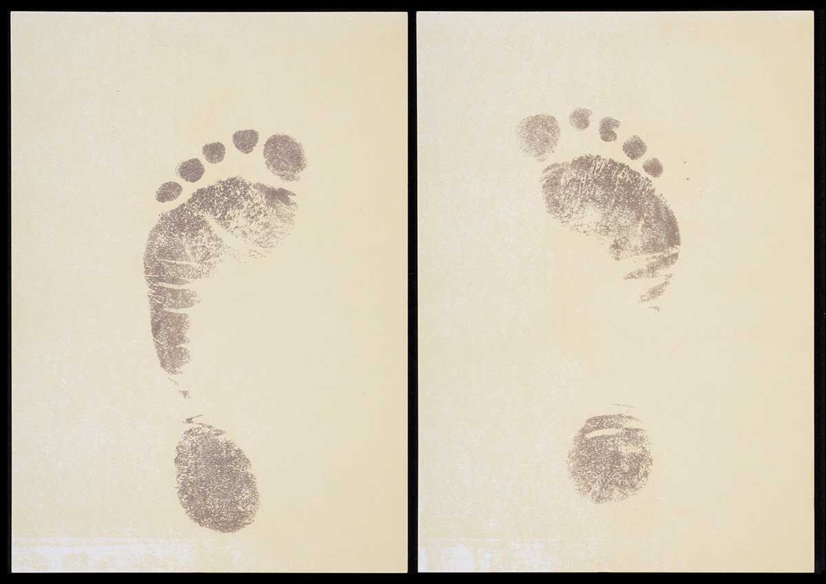 Two pages of off-white card, with printed footprints.