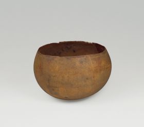 108.jpg Drinking bowl made from a light-brown young coconut where the shell was split open just above its widest point.