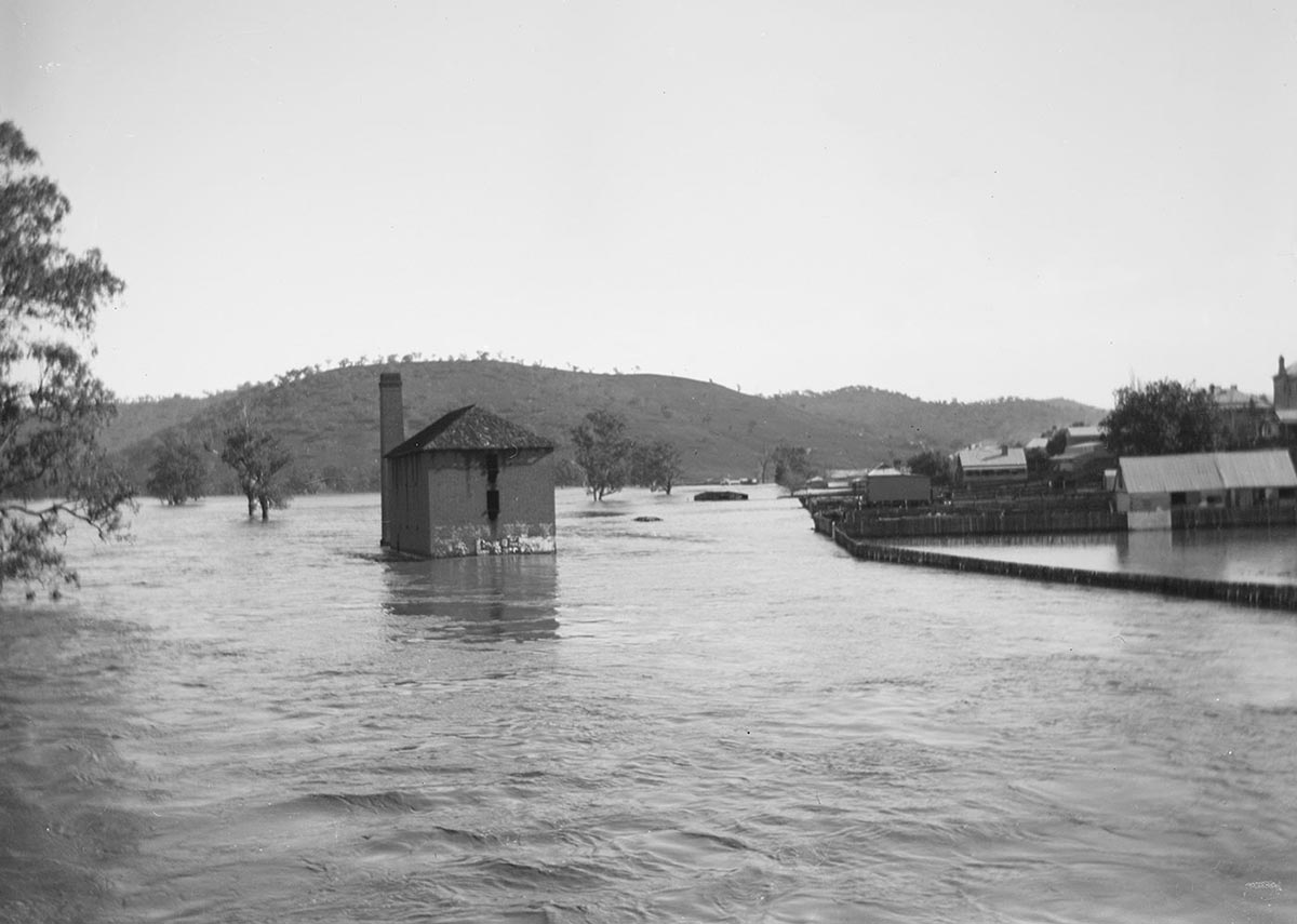 A flour mill surrounded by water.
