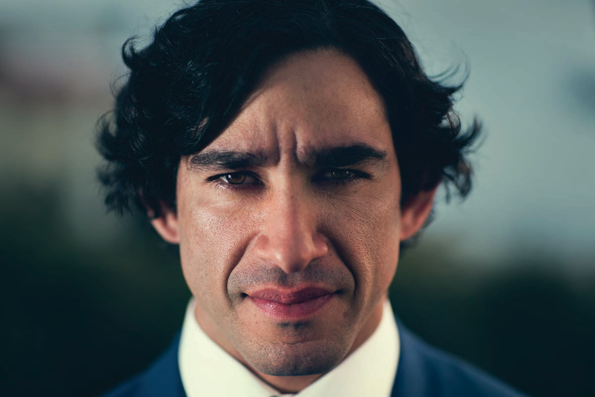 Studio portrait photograph of Johnathan Thurston.