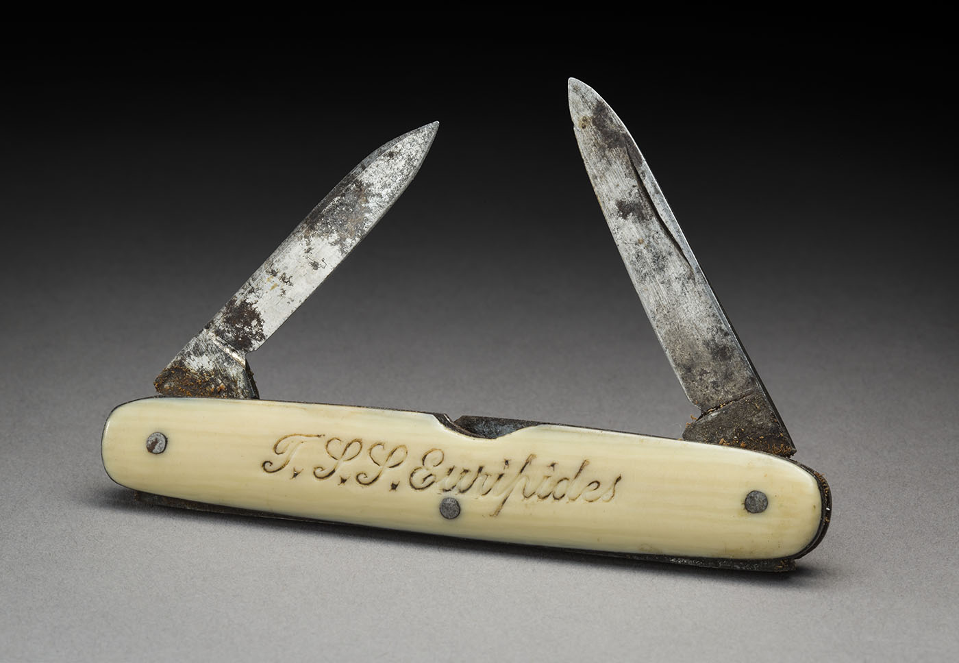 A miniature bone-handled pocket-knife inscribed 'T.S.S. Euripides' on one side.