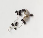 Necklaces (fragments) tuinga kahoa Oz 187 Necklace made of small brown oval seeds and white snail shells.