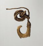 Fishhook matau Small double barbed fishhook made of bone with a serrated outer edge and twisted cord.