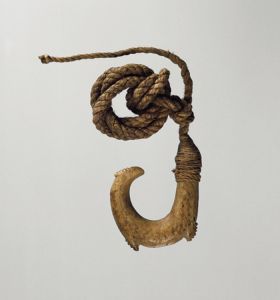 Fishhook matau Small double barbed fishhook made of bone with a serrated outer edge and twisted cord.