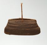 Basket kato alu Basket made of ‘alu (a native creeper with tendrils) and coconut fibres with an oval opening, in a dark brown colour.
