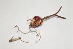 Fishing device Fishing bait or lure made of the backs of cowry shells to resemble an animal. Fishing line of plant fibre is tied to it and a mother-of-pearl hook.