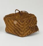 Basket kato Basket made of pandanus leaves of yellowish and brown strips with a torn handle of plaited coconut fibre.