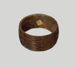 Bracelet Bracelet made from the central strip of the hard coconut shell. A zigzag pattern has been cut into the outside, running all round in a repeat pattern.