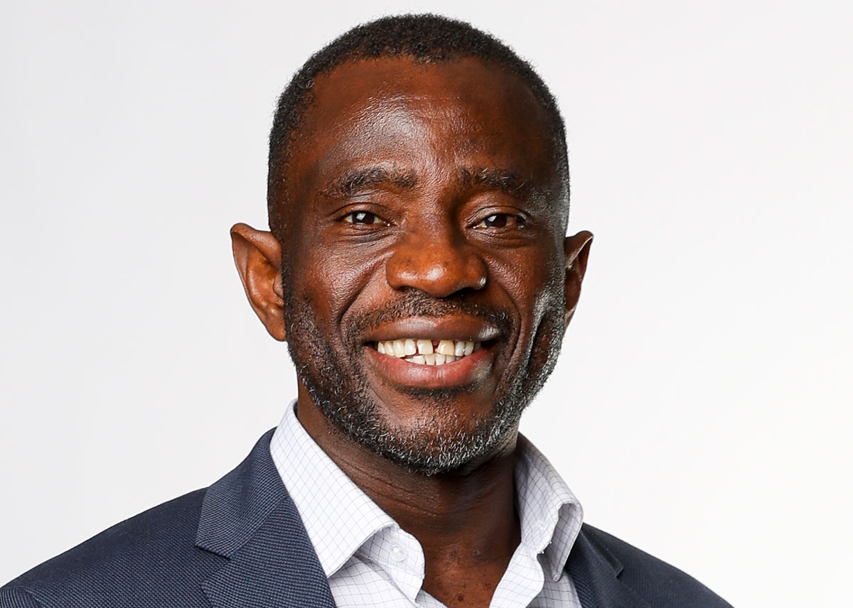 Studio portrait photograph of John Kamara.