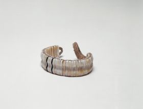 Bracelet kupe’e Bracelet made from ivory or dog teeth and turtleshell and strung together on a cord.