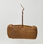 Basket kato Basket made of pandanus leaves of yellowish and brown strips with a torn handle of plaited coconut fibre.