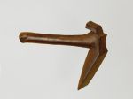 Breadfruit splitter Breadfruit splitter made of a dark brown hardwood, shaped similar to an axe. The blade and shaft are made from one piece.