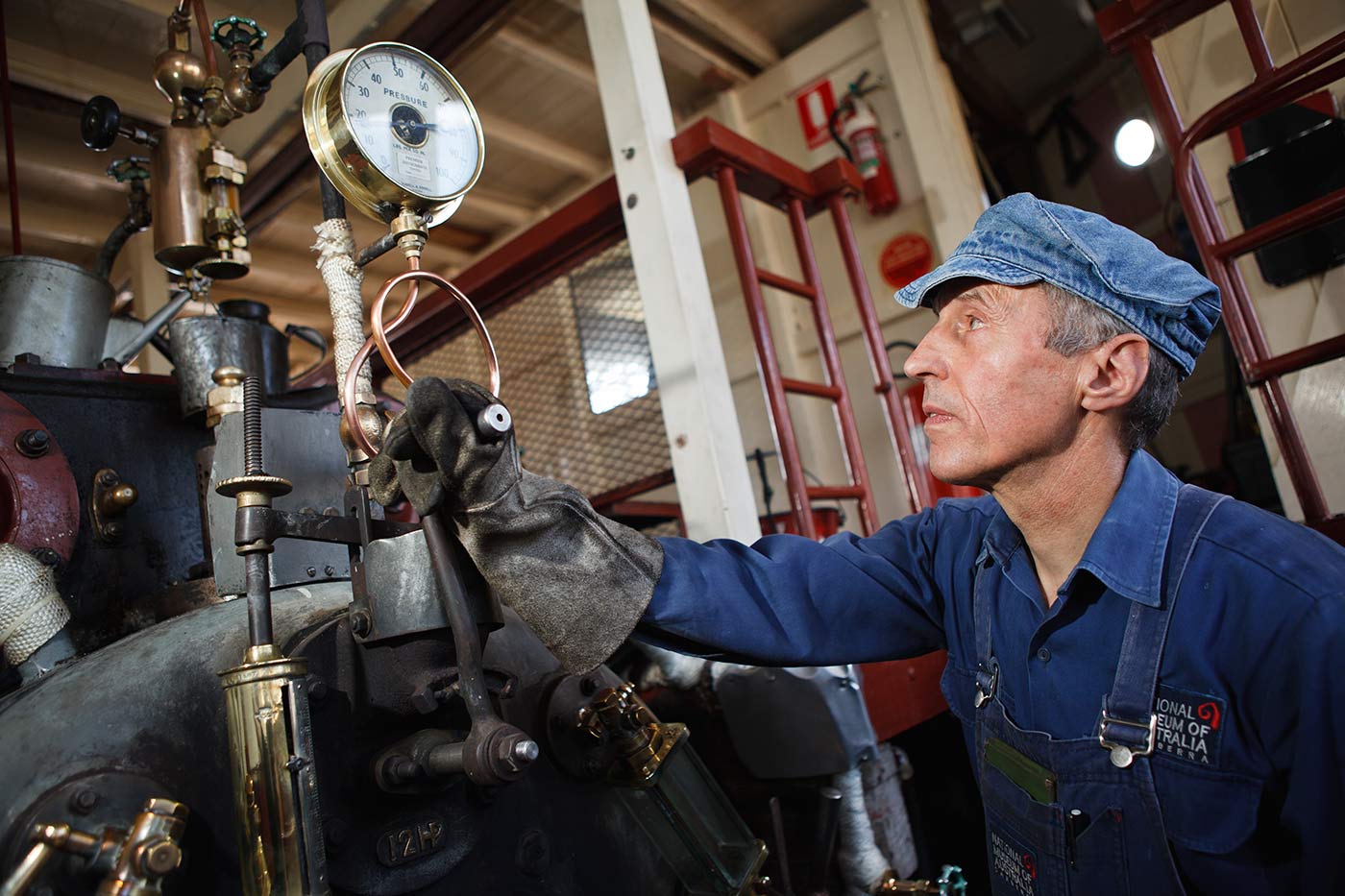 Engineer and volunteer Joe Johnson keeping the PS Enterprise steaming on Lake Burley Griffin.