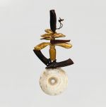 Pendant tuinga Pendant consisting of a number of elements such as bone, fish teeth and pieces of tortoiseshell tied on a string. The lowest element is a white, perforated shell disc.